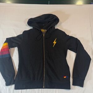 Aviator Nation Black Label with Yellow Sun Logo and Orange Stitching